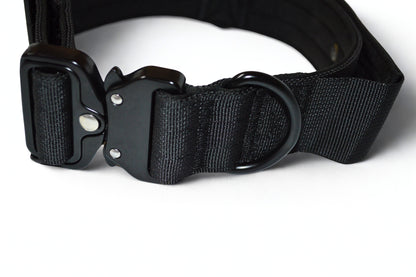 Black tactical dog collar with a buckle on a white background